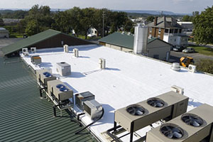 A commercial roof with white coating done by  a commercial roofing contractor