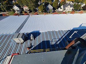 Commercial metal roofing systems