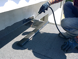 Expert who knows about Asphalt Roof Repair working on a roof